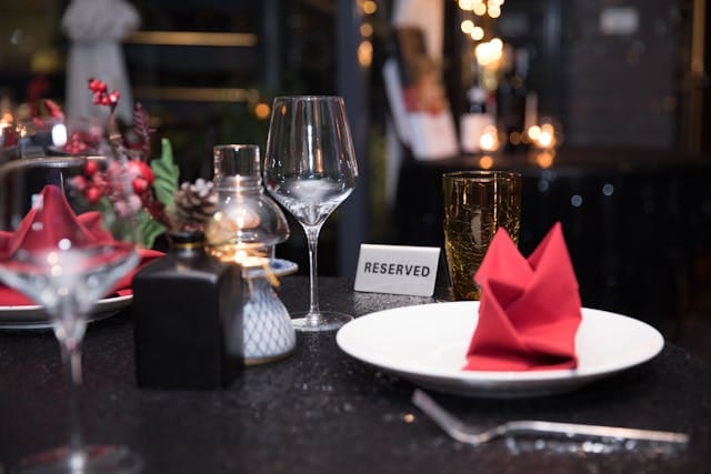 Elegant Restaurant Table with Reserved Sign | Photo by Nguyen Hung