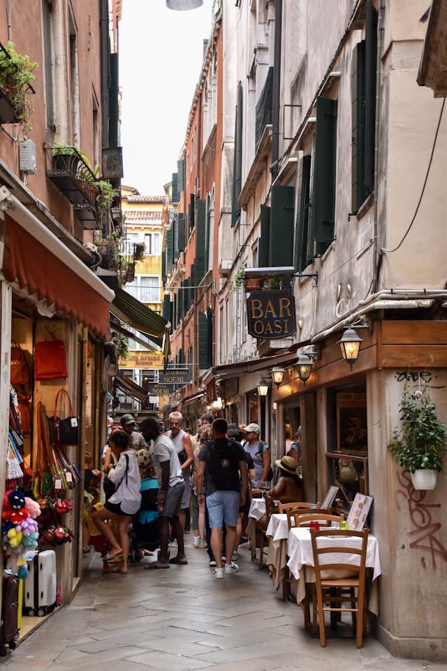 People Walking on a Narrow Street | Photo by Aleksandra S