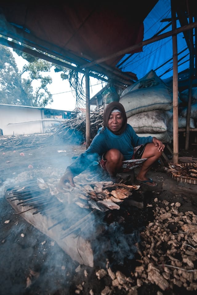 pexels-bayusamudro-10837410(1) Woman Smoking Fish