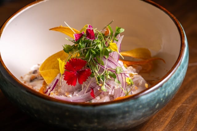Gourmet Ceviche with Fresh Garnish in Ceramic Bowl